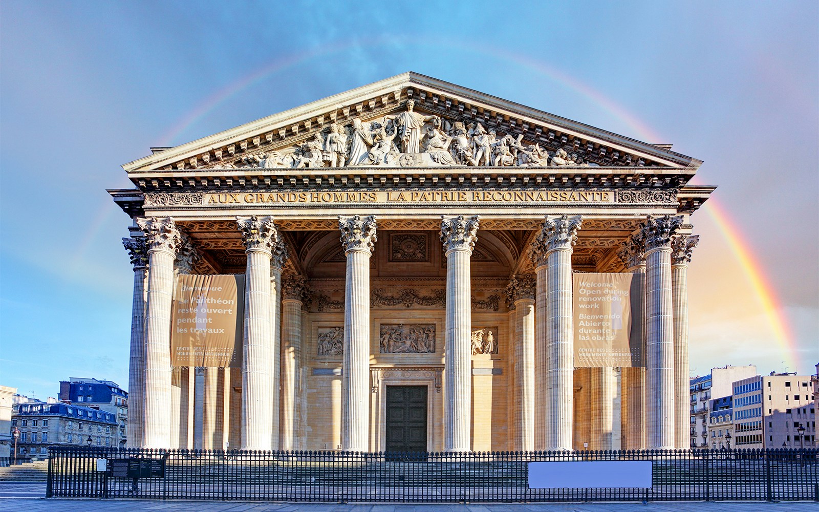 Pantheon in Paris with rainbow in the background.
