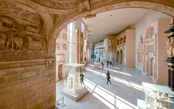 Notre-Dame de Paris exhibition at City of Architecture & Heritage, showcasing detailed architectural models and sculptures.