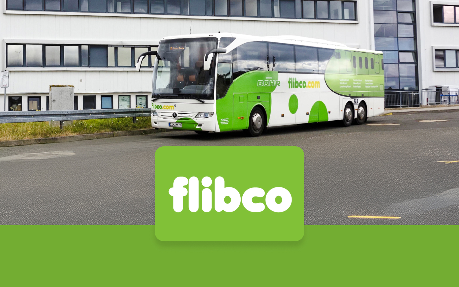Flibco bus parked near a building, offering transfers between London Stansted Airport and London City.