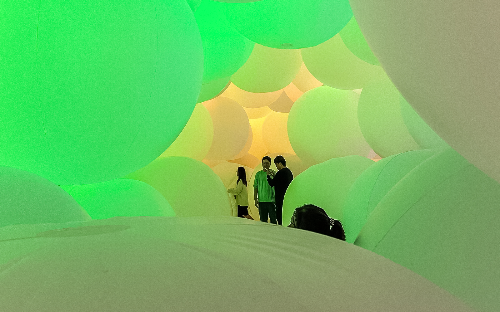 Visitors exploring the expanding three-dimensional space at TeamLab exhibit in Tokyo