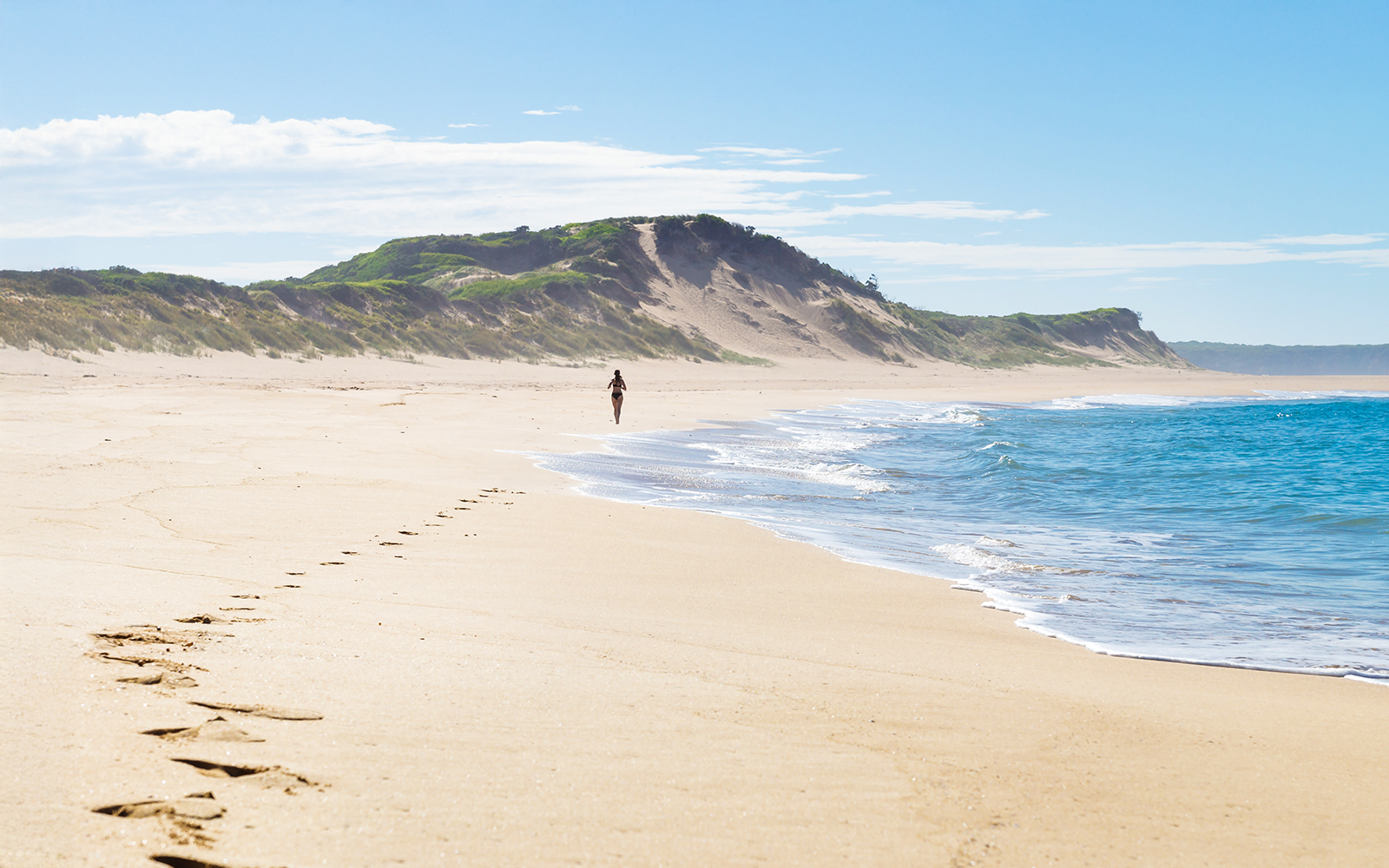 Footsteps of a female runner at the beach of Peterborough at the Great Ocean Road, Victoria, Australia