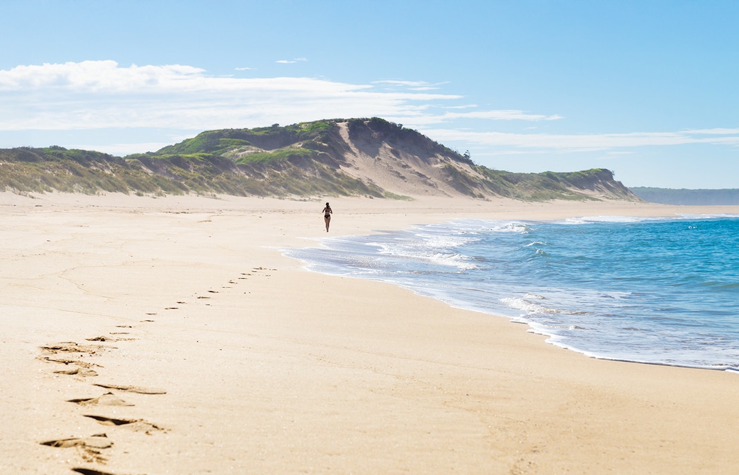 Footsteps of a female runner at the beach of Peterborough at the Great Ocean Road, Victoria, Australia