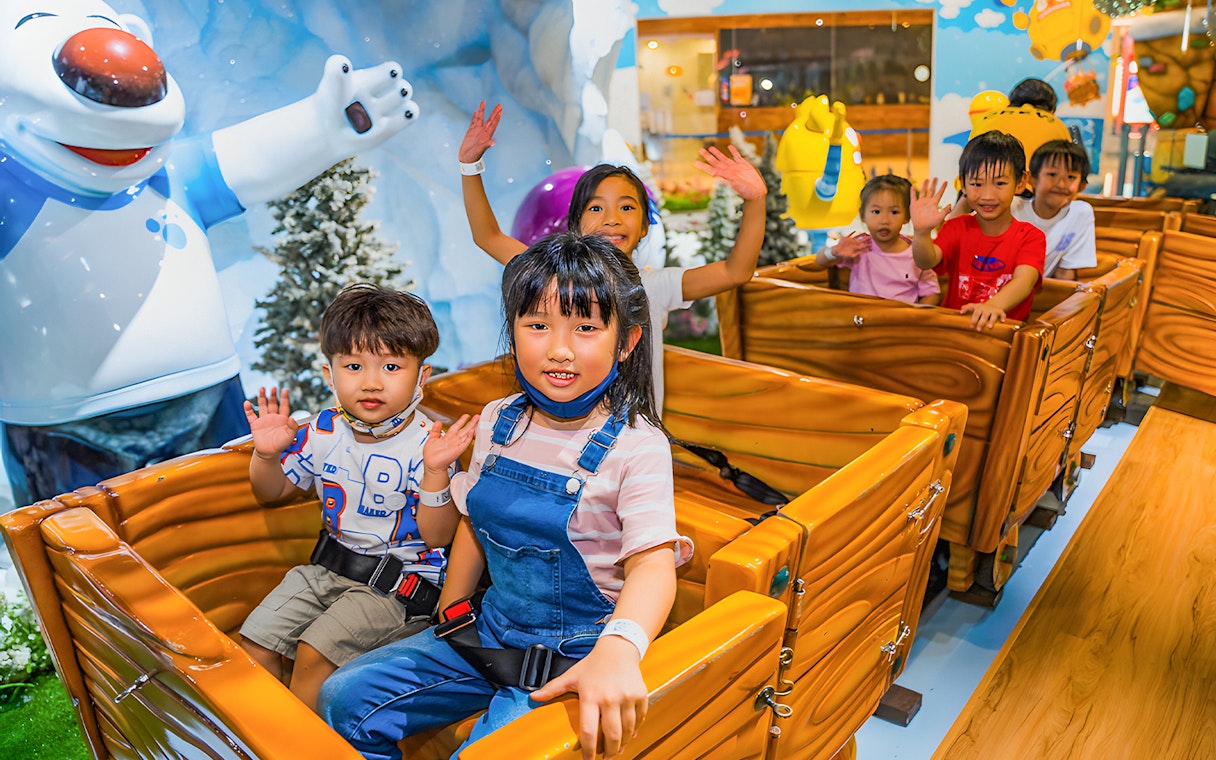 Children enjoying a ride at Pororo Park Singapore.