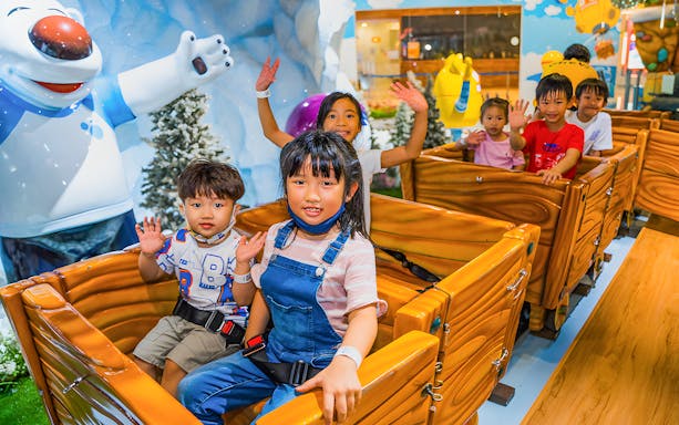 Children enjoying a ride at Pororo Park Singapore.