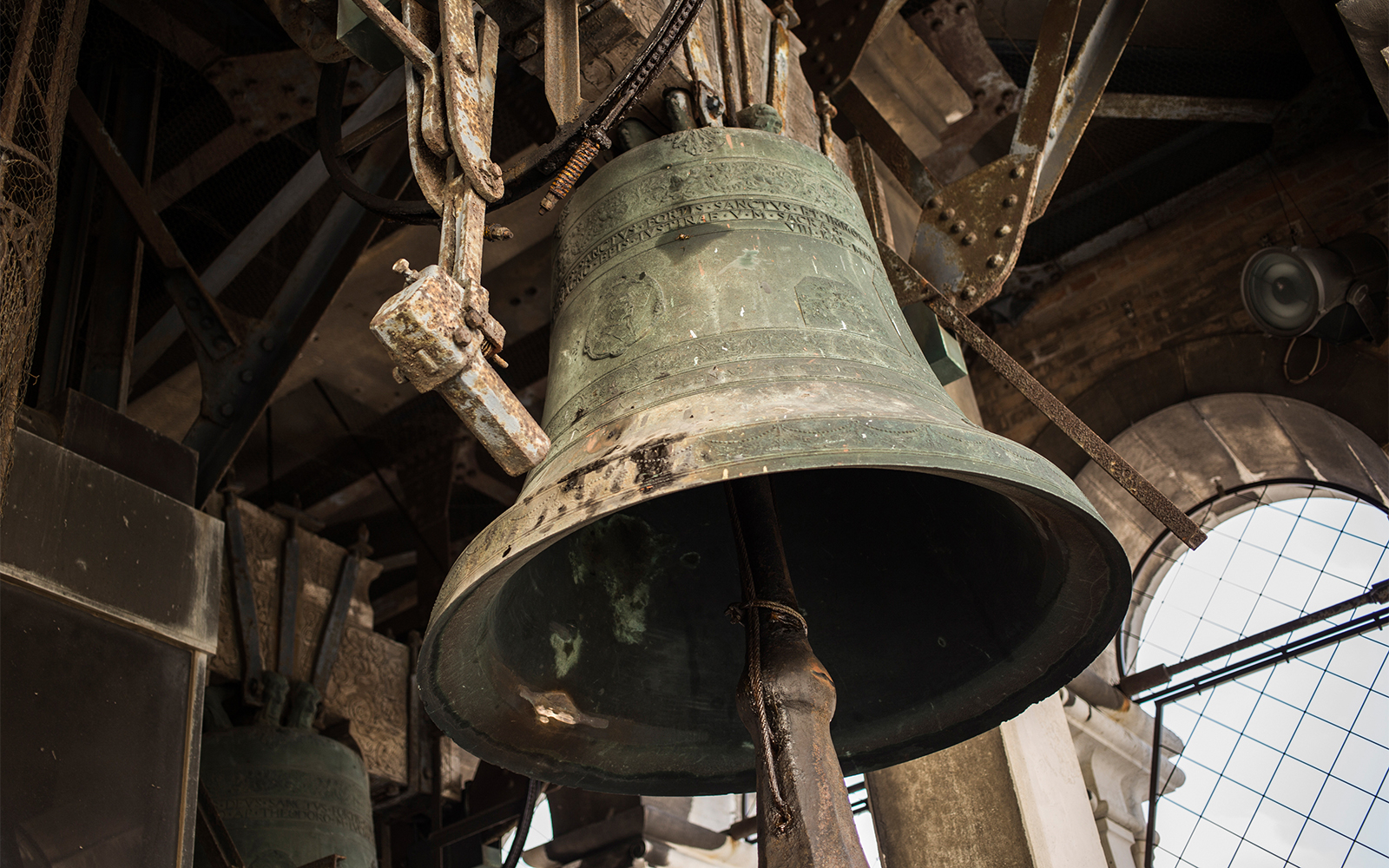 Campanile bell in San Marco Square, Venice, with architectural details.