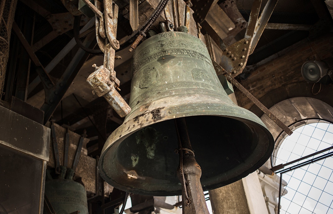 Campanile bell in San Marco Square, Venice, with architectural details.