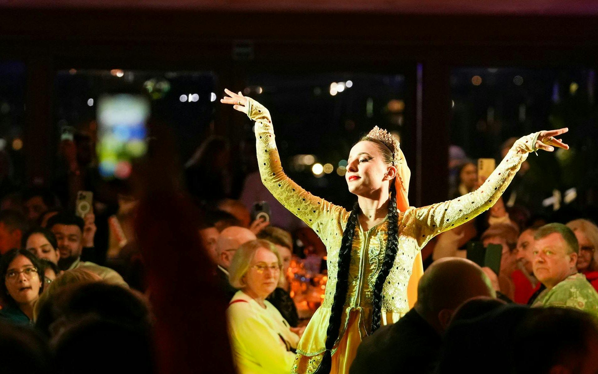 Dancer performing on Luxury Bosphorus Dinner Cruise at night.