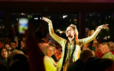 Dancer performing on Luxury Bosphorus Dinner Cruise at night.