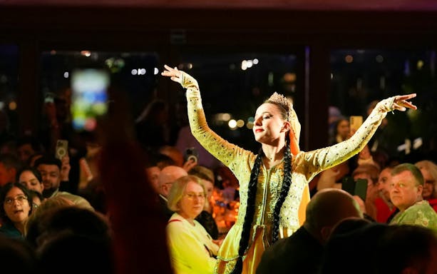 Dancer performing on Luxury Bosphorus Dinner Cruise at night.