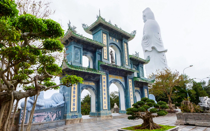 Linh Ung Pagoda entrance with Lady Buddha statue on Son Tra Peninsula, Da Nang, Vietnam.