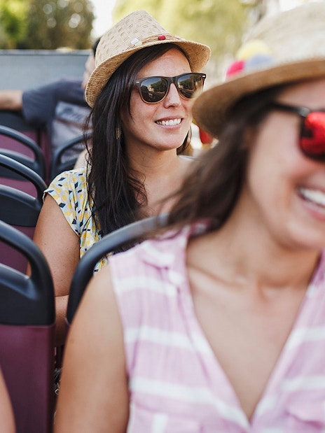 Tourists enjoying Reykjavik hop-on hop-off bus tour.