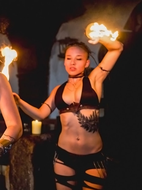 Fire dancers performing at a medieval dinner show in Dětenice, near Prague.