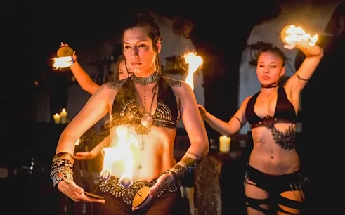 Fire dancers performing at a medieval dinner show in Dětenice, near Prague.