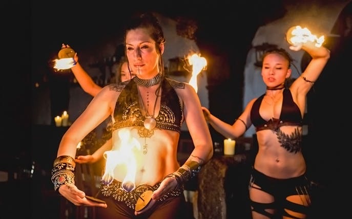 Fire dancers performing at a medieval dinner show in Dětenice, near Prague.