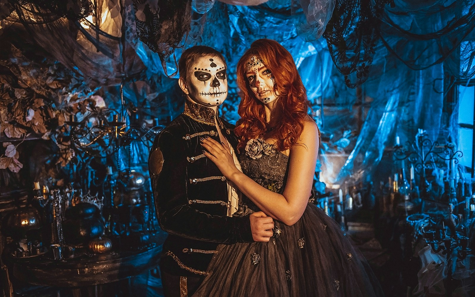 Couple in Halloween costumes with face paint