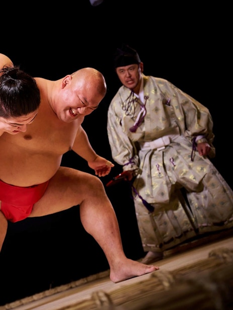 Sumo wrestlers in action during a match at Hirakuza Ginza, Tokyo.
