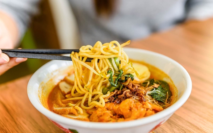 Laksa noodles with vegetables and seafood at Good Old Days international buffet.