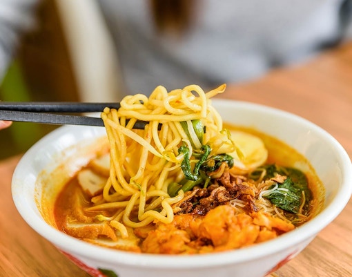 Laksa noodles with vegetables and seafood at Good Old Days international buffet.