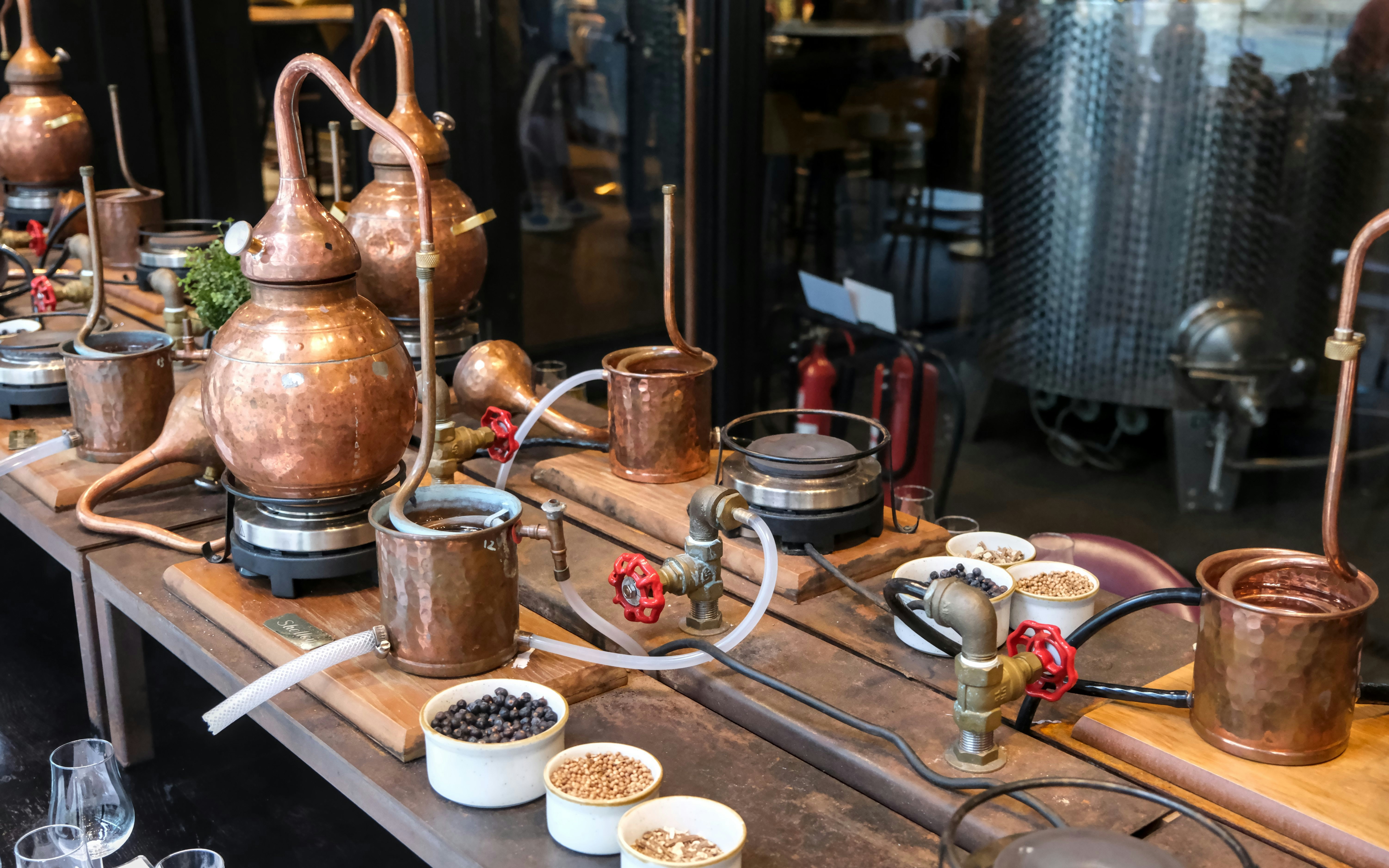 Antique copper distillation tools at The Scotch Whisky Experience.