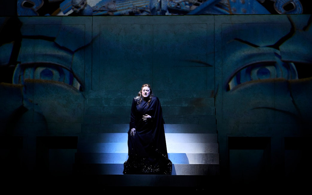 Stage performance of Turandot in Sydney with a singer on illuminated steps.