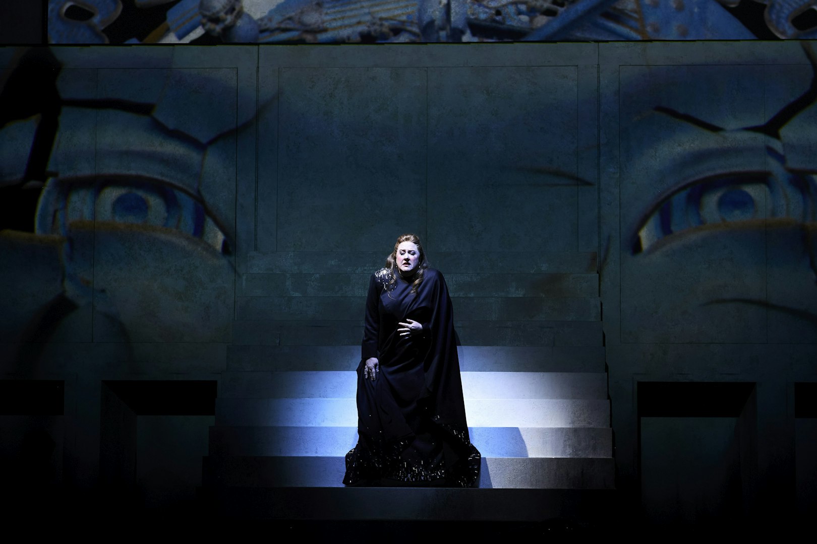 Stage performance of Turandot in Sydney with a singer on illuminated steps.