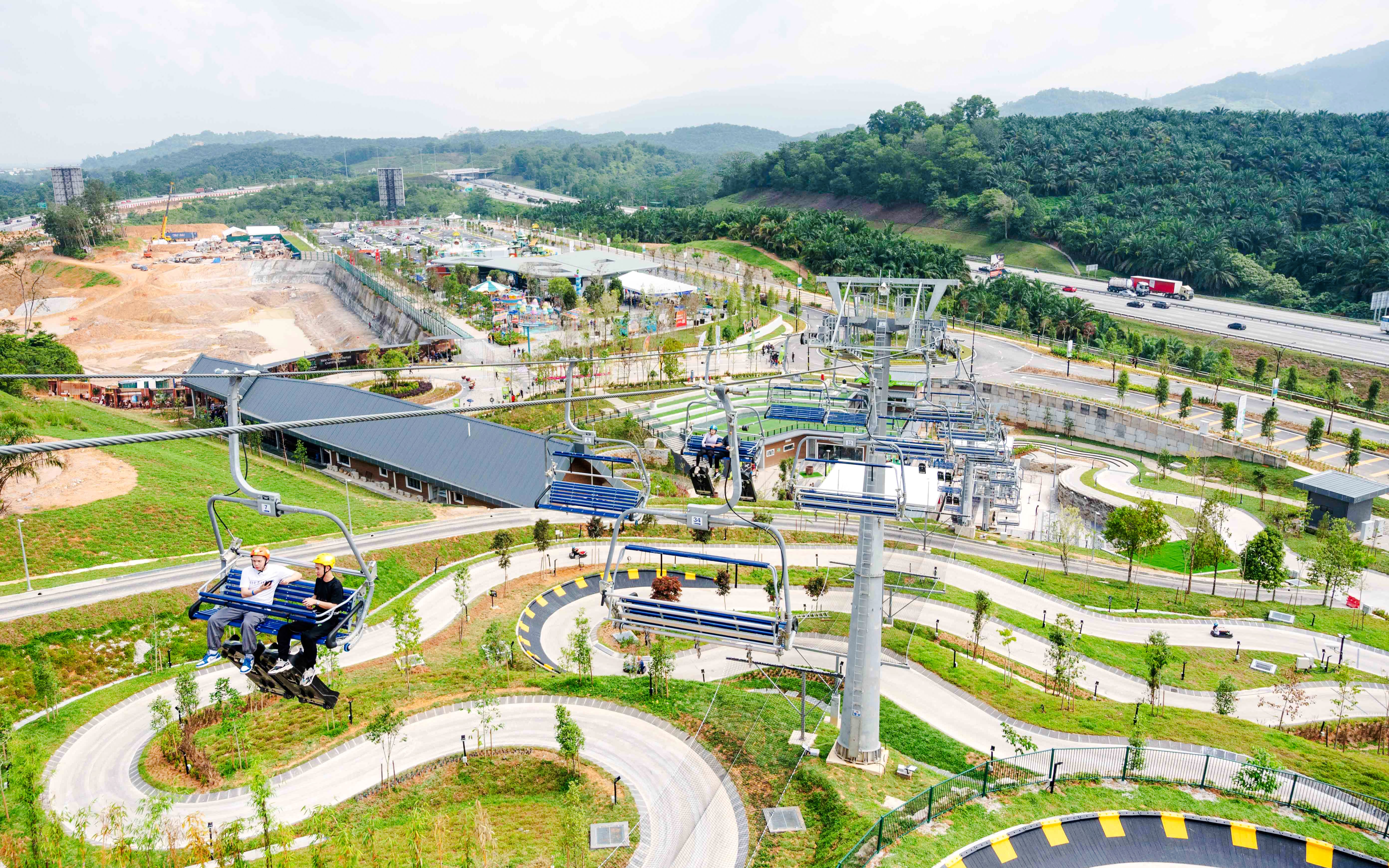 Aerial view of Skyline Luge Kuala Lumpur with winding tracks and chairlift.