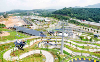 Aerial view of Skyline Luge Kuala Lumpur with winding tracks and chairlift.