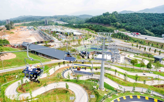 Aerial view of Skyline Luge Kuala Lumpur with winding tracks and chairlift.