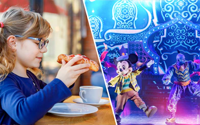 Mickey Mouse performing on stage at Disneyland Paris with a child enjoying a pastry nearby.