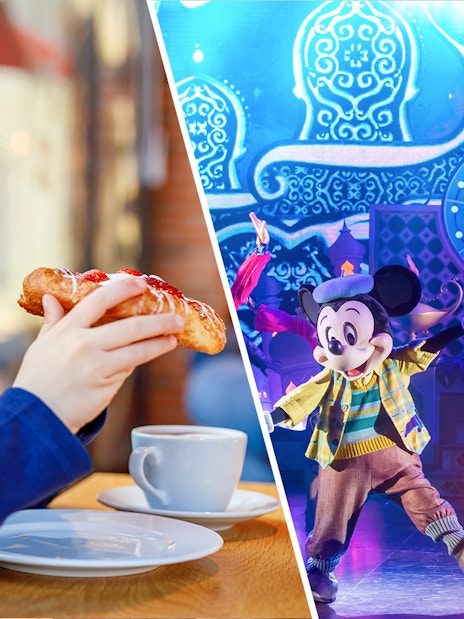 Mickey Mouse performing on stage at Disneyland Paris with a child enjoying a pastry nearby.