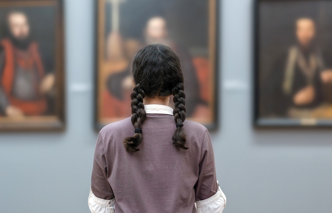 Accademia Gallery with visitors exploring exhibits.