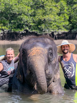 Elephant with visitors at Krabi Elephant Shelter, Thailand.