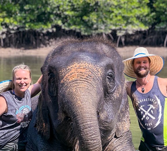 Elephant with visitors at Krabi Elephant Shelter, Thailand.