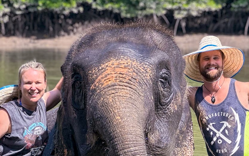 Elephant with visitors at Krabi Elephant Shelter, Thailand.