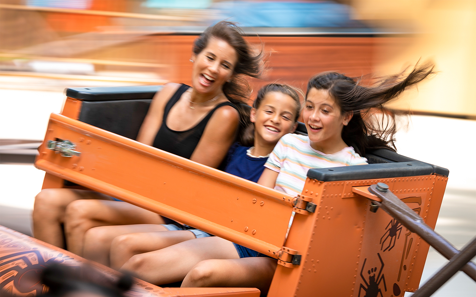 Riders enjoying Arachnidia ride at Six Flags King's Dominion.