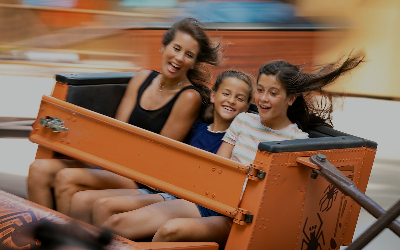 Riders enjoying Arachnidia ride at Six Flags King's Dominion.