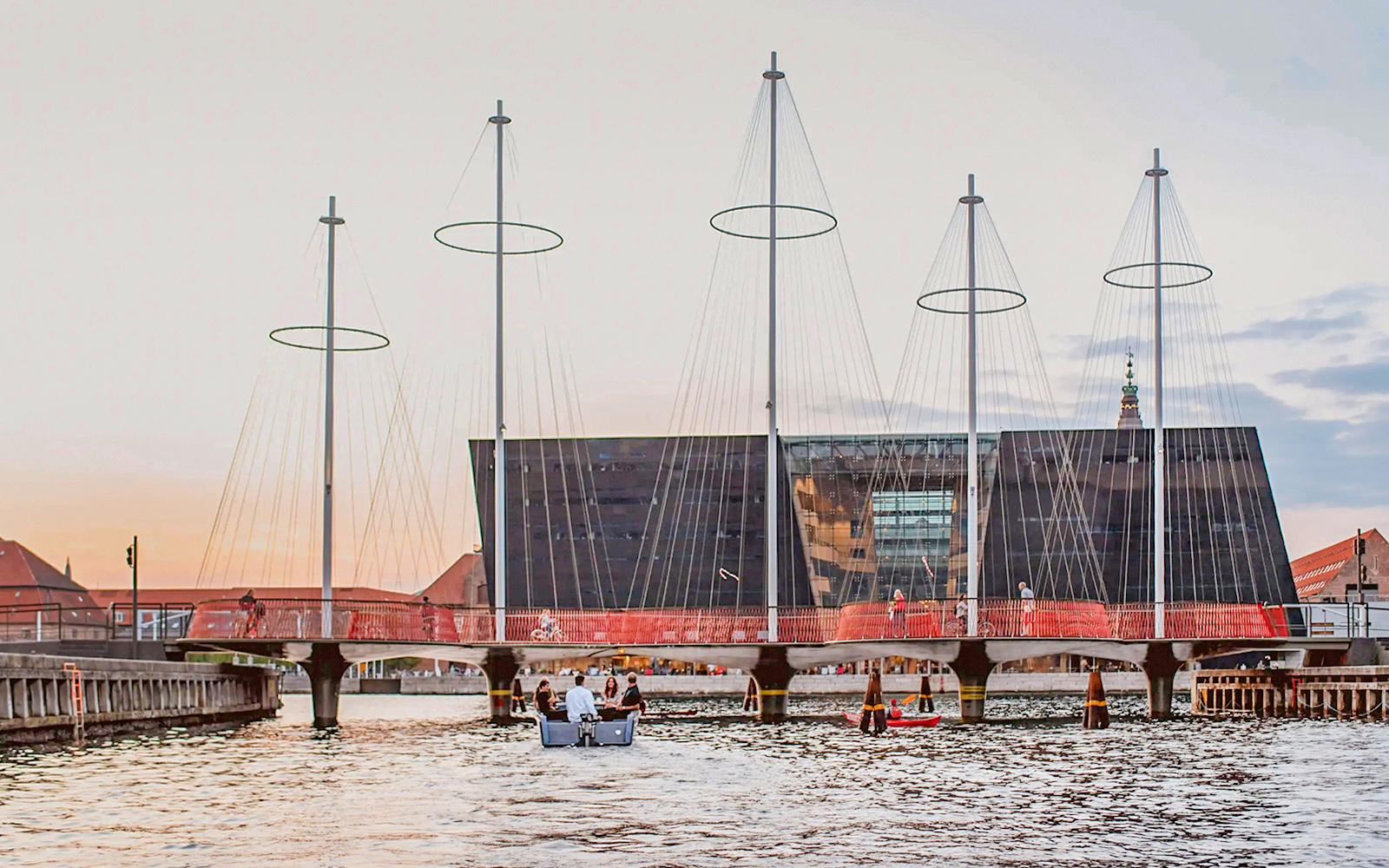 Circle Bridge over Copenhagen Harbor with cityscape backdrop.