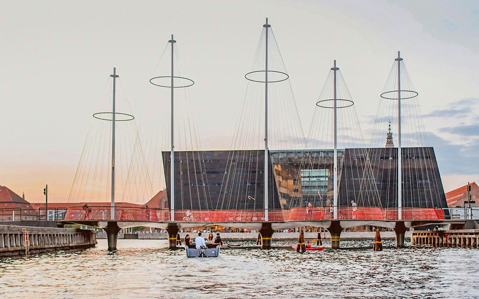 Circle Bridge spanning Copenhagen Harbor with cityscape in the background.