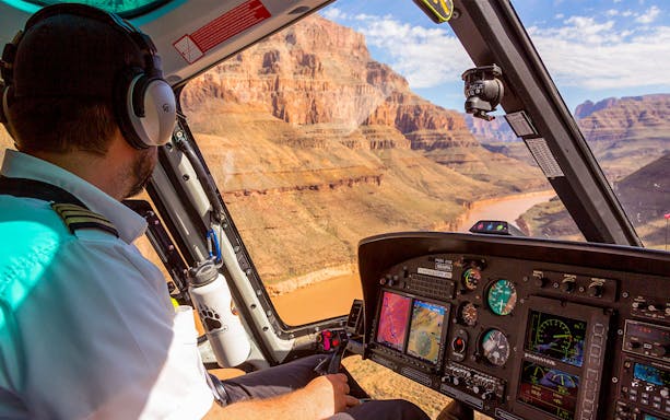 Helicopter cockpit view of Grand Canyon during Grand Celebration and Black Canyon Raft tour.