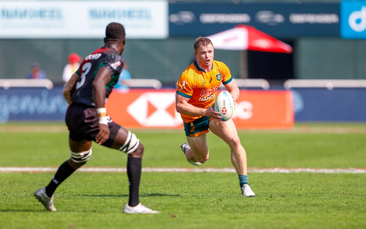 Rugby players in action during Emirates Dubai 7s match, Dubai stadium.