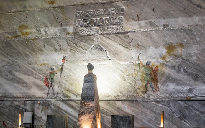Slanic Prahova Salt Mine interior with Roman carvings and statue, near Bucharest.