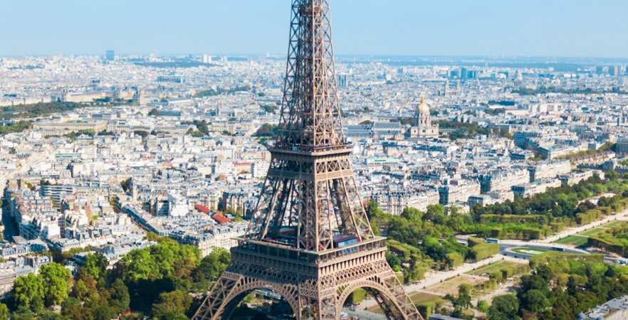 Eiffel Tower aerial view with Paris cityscape in the background.