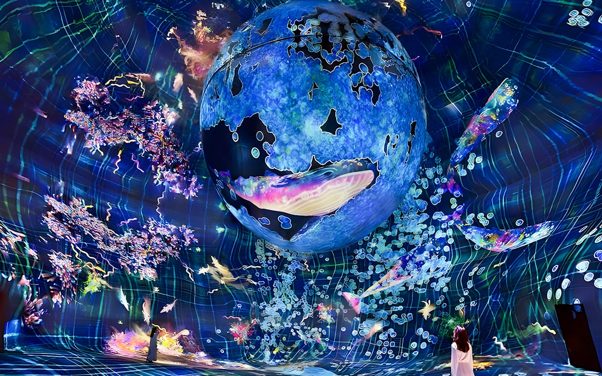 Immersive digital art installation at TeamLab Phenomena Abu Dhabi with vibrant colors and abstract forms.