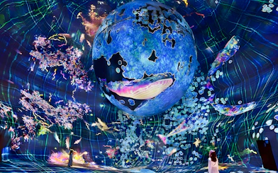 Immersive digital art installation at TeamLab Phenomena Abu Dhabi with vibrant colors and abstract forms.