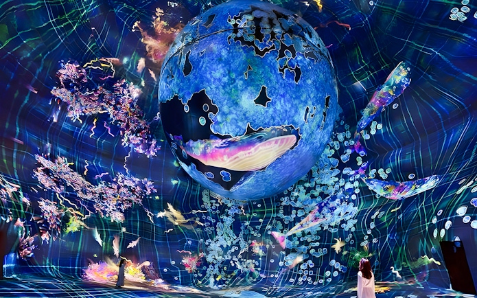 Immersive digital art installation at TeamLab Phenomena Abu Dhabi with vibrant colors and abstract forms.