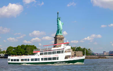 Circle Line cruise passing the Statue of Liberty in New York City.