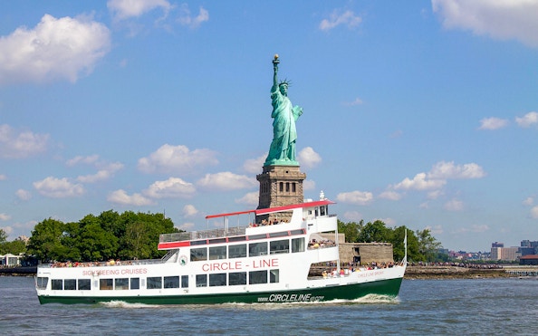 Circle Line cruise passing the Statue of Liberty in New York City.