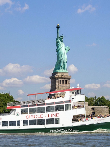Circle Line cruise passing the Statue of Liberty in New York City.