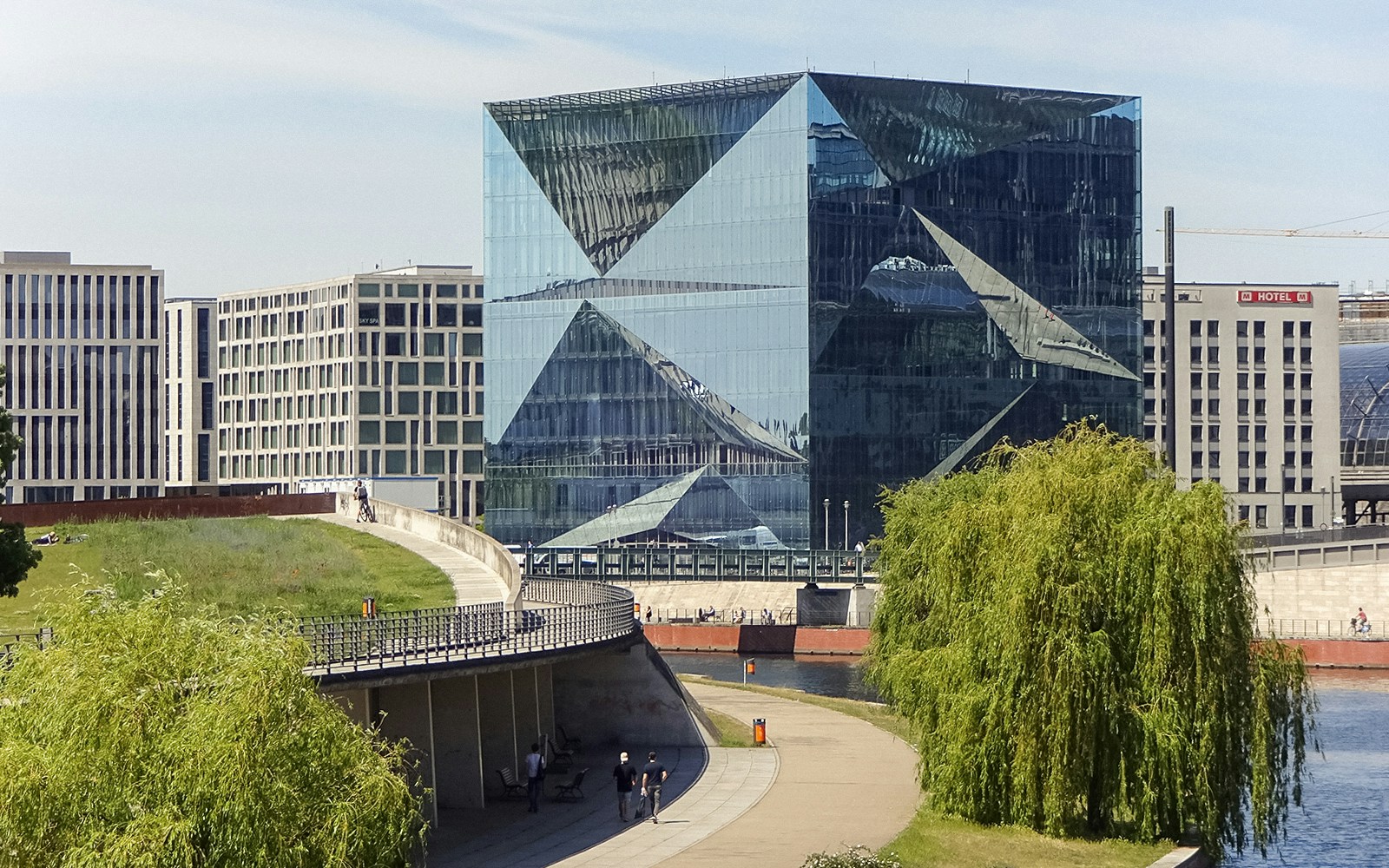 Modern glass building along the Spree River in Berlin during sightseeing cruise.