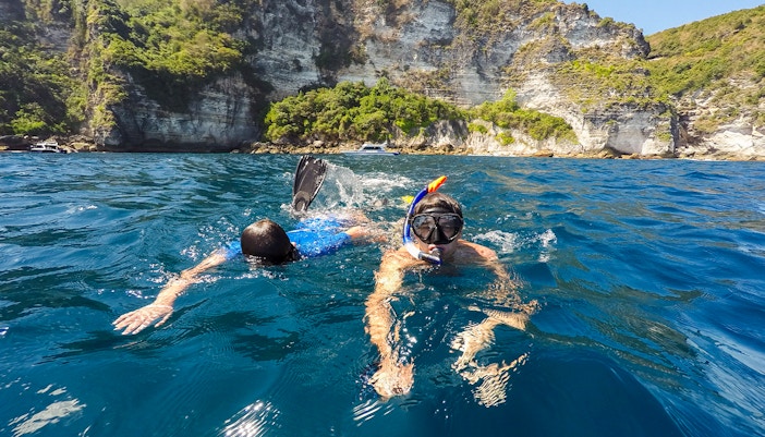 Tourists enjoying the scenic view of East/West/South Nusa Penida Island during an Instagrammable Private Tour with Hotel Transfers